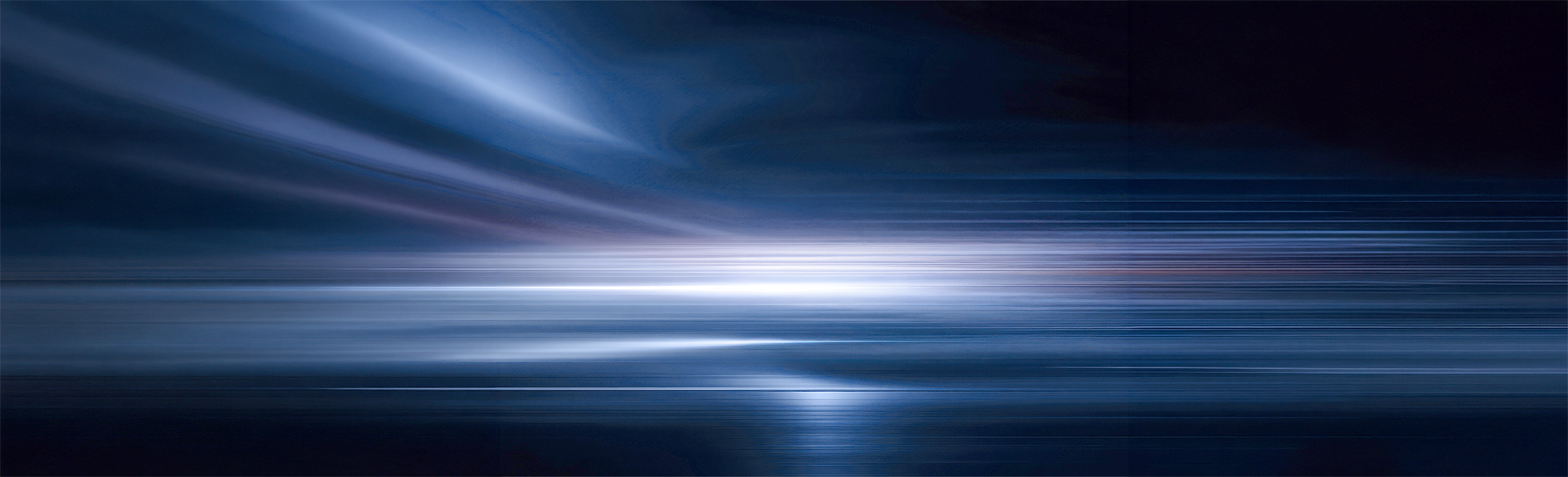 Abstract blue-toned image with horizontal light streaks forming a bright horizon over a smooth surface, suggesting speed and a sense of vast, open space.