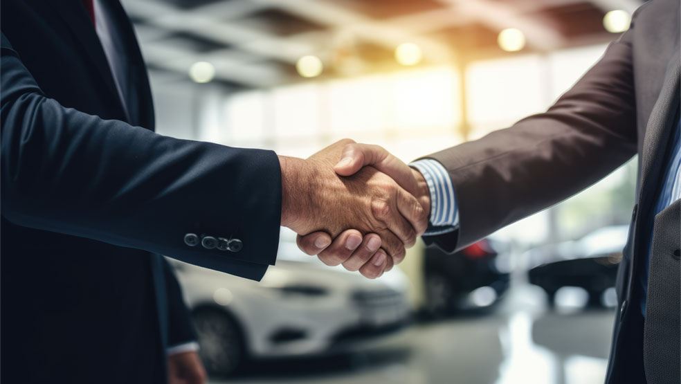 Handshake in a car dealership